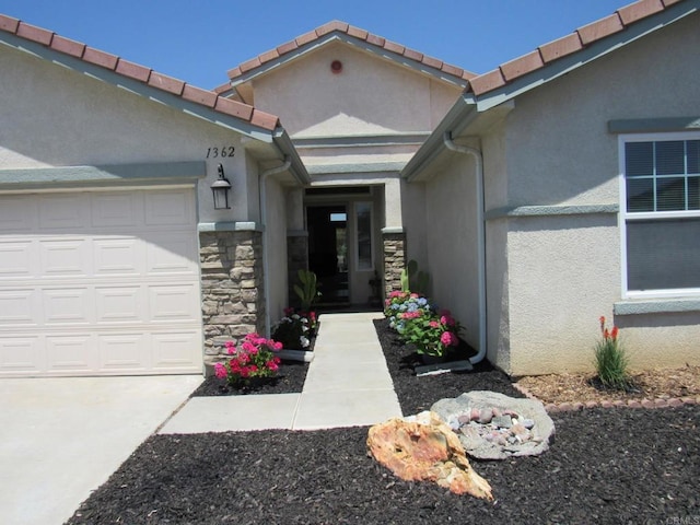 1362 Buckwheat Trl, Campo, CA 91906 - view of exterior entry with stone siding, stucco siding, and an attached garage