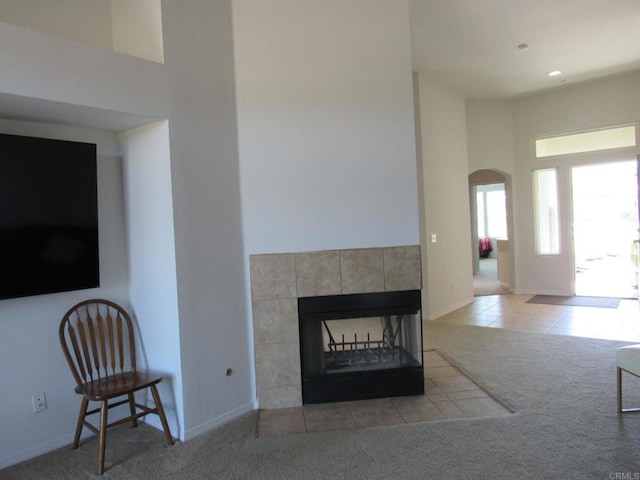 1362 Buckwheat Trl, Campo, CA 91906 - living area with carpet, arched walkways, tile patterned flooring, a tile fireplace, and recessed lighting