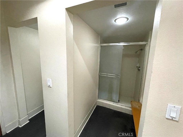 2563 Plaza Del Amo Unit 304, Torrance, CA 90503 - bathroom with a stall shower and baseboards