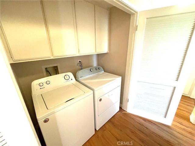 2563 Plaza Del Amo Unit 304, Torrance, CA 90503 - laundry room featuring washer and dryer, cabinet space, and light wood-type flooring