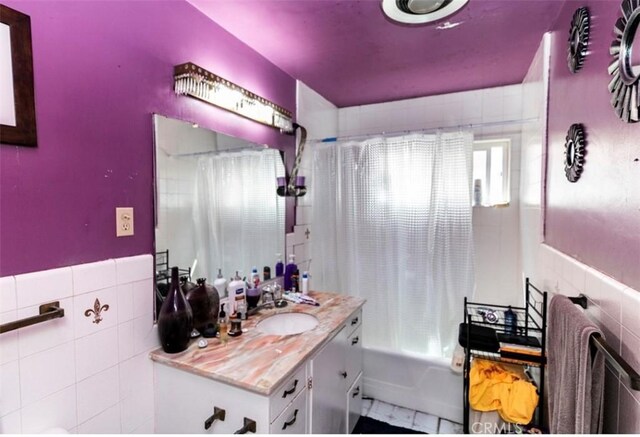 4547 W 141st St, Hawthorne, CA 90250 - bathroom featuring tile walls, vanity, and shower / bathtub combination with curtain