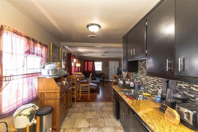 4547 W 141st St, Hawthorne, CA 90250 - kitchen with tasteful backsplash, light stone finish flooring, and open floor plan