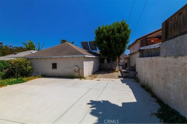 4547 W 141st St, Hawthorne, CA 90250 - view of home's exterior featuring a patio area and stucco siding