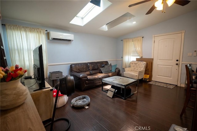 161 N Cota St, Corona, CA 92882 - living room with an AC wall unit, vaulted ceiling, ceiling fan, a skylight, and wood finished floors