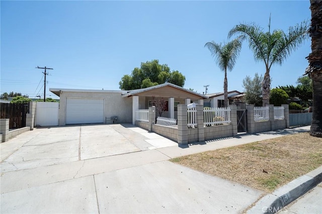 161 N Cota St, Corona, CA 92882 - ranch-style house featuring an attached garage, a fenced front yard, concrete driveway, a gate, and stucco siding