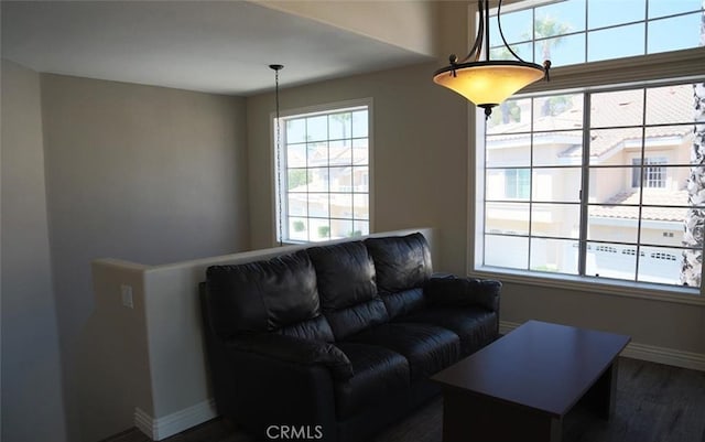 27971 Via Moreno, Laguna Niguel, CA 92677 - living area with dark wood finished floors, healthy amount of natural light, and baseboards