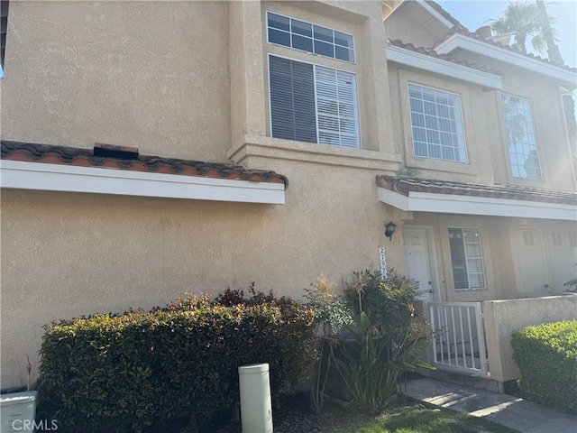 27971 Via Moreno, Laguna Niguel, CA 92677 - view of home's exterior featuring stucco siding, a fenced front yard, and a gate