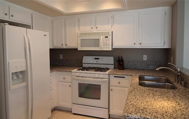 27971 Via Moreno, Laguna Niguel, CA 92677 - kitchen with white appliances, a sink, white cabinets, light stone countertops, and ornamental molding