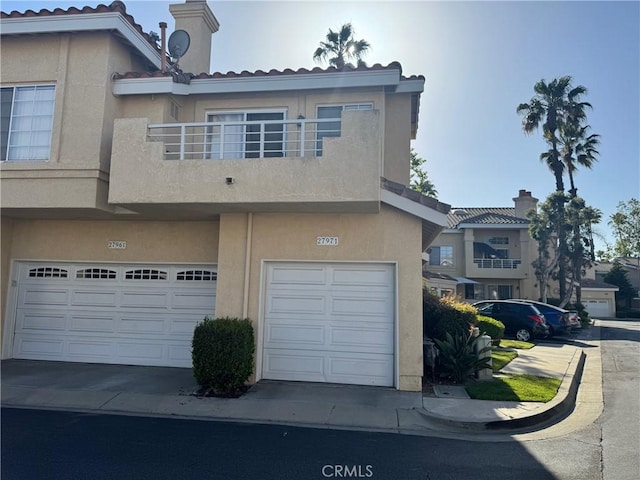 27971 Via Moreno, Laguna Niguel, CA 92677 - multi unit property with stucco siding, an attached garage, a balcony, and a tiled roof