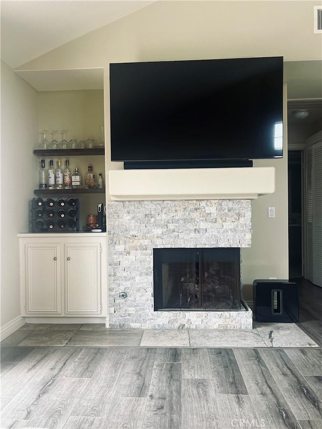 27971 Via Moreno, Laguna Niguel, CA 92677 - detailed view of a stone fireplace, wood finished floors, and baseboards