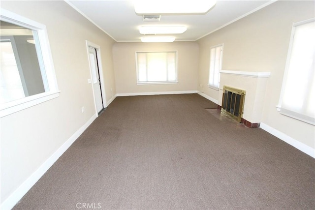 3641 Adams St, Riverside, CA 92504 - unfurnished living room featuring dark colored carpet, crown molding, a fireplace with flush hearth, and baseboards