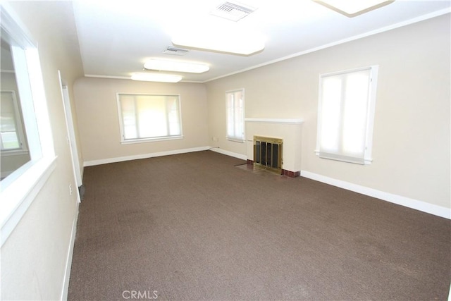 3641 Adams St, Riverside, CA 92504 - unfurnished living room with a fireplace with flush hearth, dark carpet, ornamental molding, and baseboards