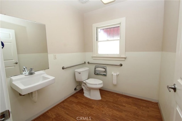 3641 Adams St, Riverside, CA 92504 - bathroom featuring a sink, toilet, and wood finished floors