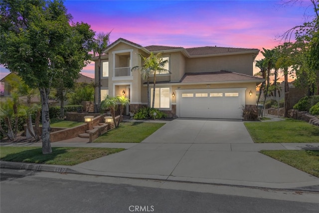 4127 Forest Highlands Cir, Corona, CA 92883 - traditional-style home with stucco siding, an attached garage, driveway, a lawn, and stone siding
