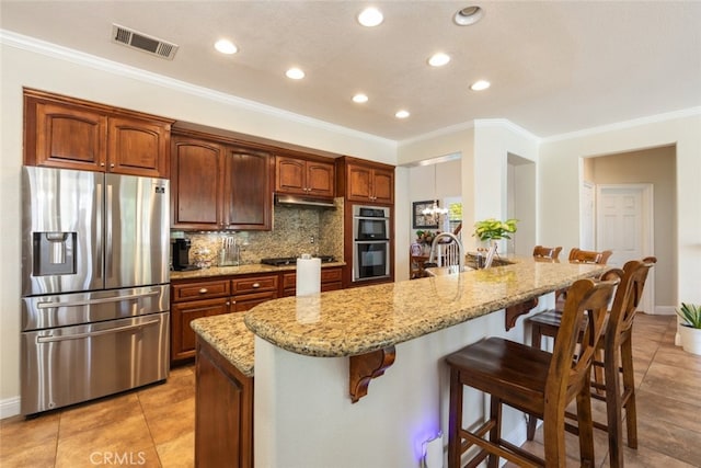 4127 Forest Highlands Cir, Corona, CA 92883 - kitchen featuring appliances with stainless steel finishes, a breakfast bar, light stone countertops, recessed lighting, and backsplash