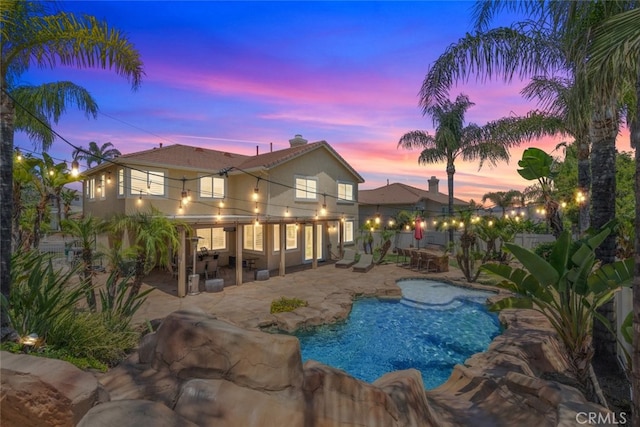 4127 Forest Highlands Cir, Corona, CA 92883 - pool at dusk featuring a patio area and an outdoor pool