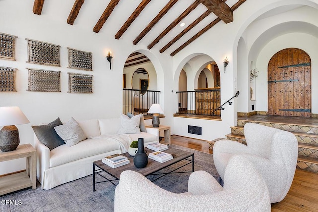 4144 Chevy Chase Dr, La Canada Flintridge, CA 91011 - living area featuring beam ceiling, arched walkways, wood finished floors, stairs, and recessed lighting