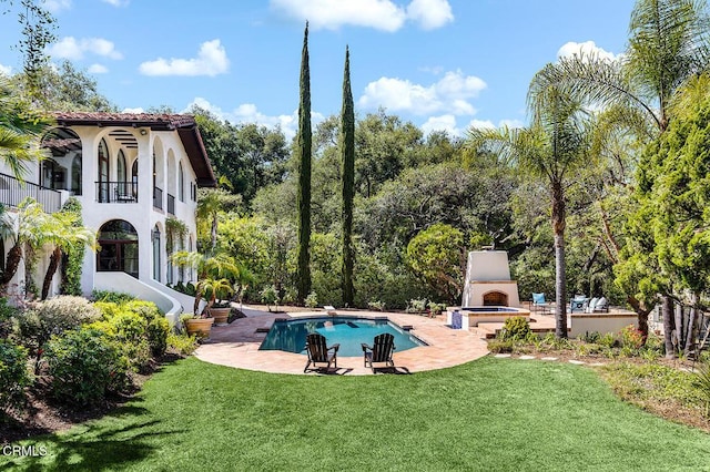 4144 Chevy Chase Dr, La Canada Flintridge, CA 91011 - outdoor pool featuring a patio, exterior fireplace, a yard, and a diving board