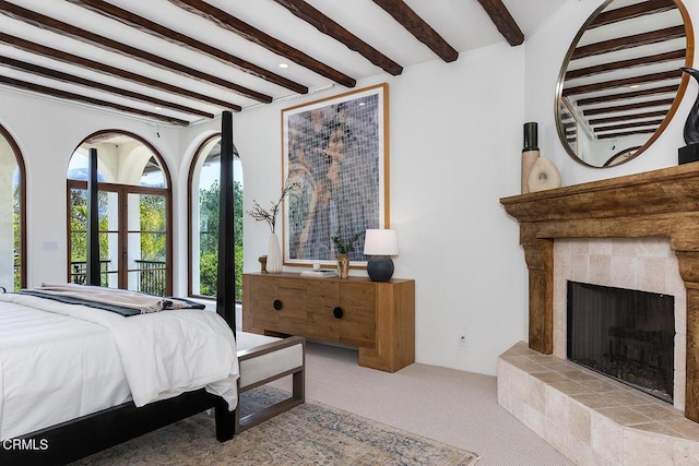 4144 Chevy Chase Dr, La Canada Flintridge, CA 91011 - bedroom with beam ceiling, carpet, and a tiled fireplace
