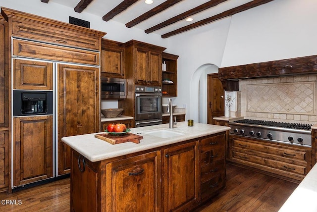 4144 Chevy Chase Dr, La Canada Flintridge, CA 91011 - kitchen with stainless steel appliances, a sink, tasteful backsplash, dark wood-style floors, and open shelves