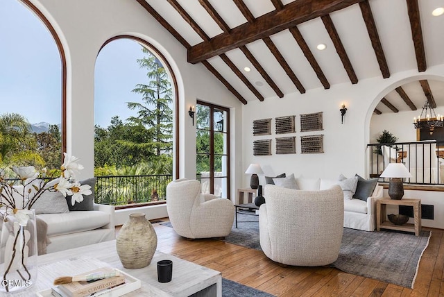 4144 Chevy Chase Dr, La Canada Flintridge, CA 91011 - living area with recessed lighting, beam ceiling, hardwood / wood-style flooring, arched walkways, and high vaulted ceiling