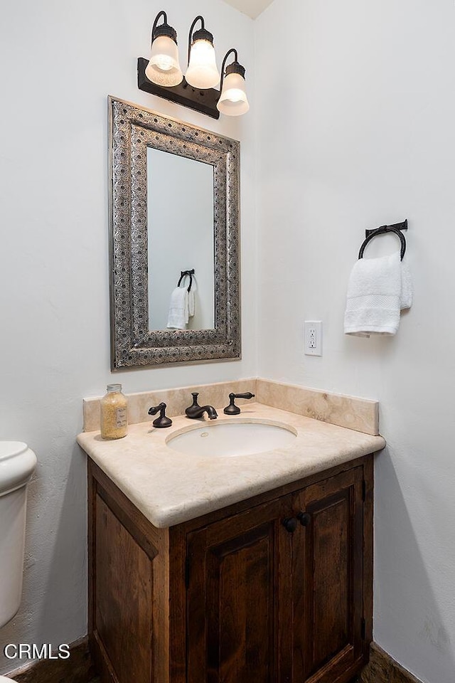 4144 Chevy Chase Dr, La Canada Flintridge, CA 91011 - half bathroom featuring vanity and toilet