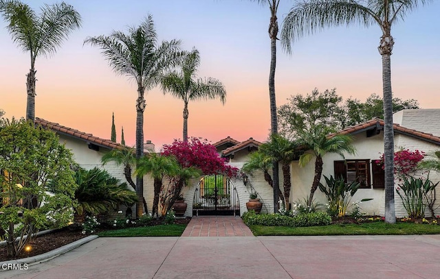 4144 Chevy Chase Dr, La Canada Flintridge, CA 91011 - view of front of property with stucco siding, a tiled roof, and a gate