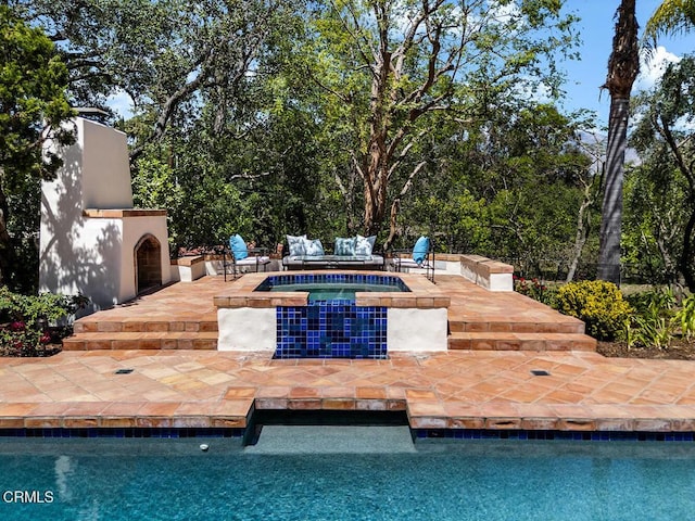 4144 Chevy Chase Dr, La Canada Flintridge, CA 91011 - swimming pool featuring a patio area, an in-ground hot tub, and an outdoor living space with a fireplace