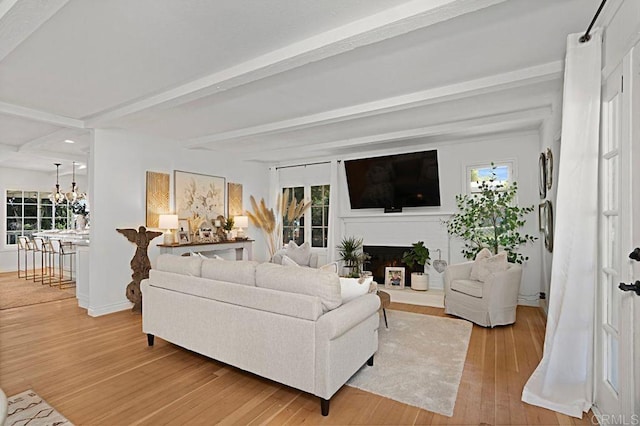 17030 Grand Ave, Lake Elsinore, CA 92530 - living room with light wood-style floors, beam ceiling, a chandelier, a fireplace, and recessed lighting