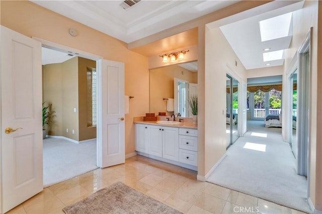 48 Via Porto Grande, Rancho Palos Verdes, CA 90275 - bathroom featuring vanity, a skylight, tile patterned flooring, recessed lighting, and ensuite bath