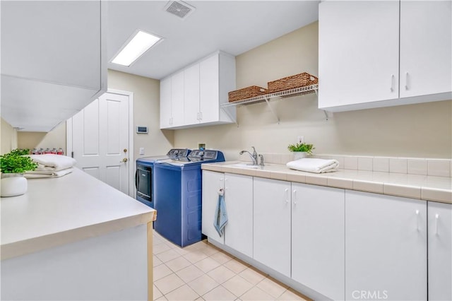 48 Via Porto Grande, Rancho Palos Verdes, CA 90275 - laundry area with washer and clothes dryer, cabinet space, and light tile patterned floors
