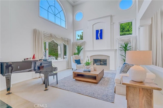 48 Via Porto Grande, Rancho Palos Verdes, CA 90275 - living room featuring a high ceiling, a glass covered fireplace, and healthy amount of natural light