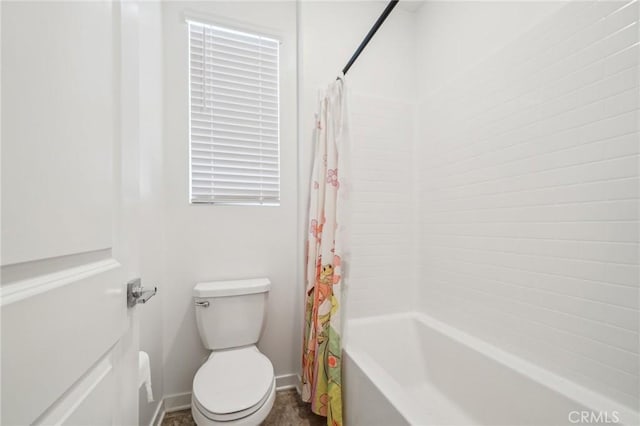 16233 Lozano St Unit 2, Fontana, CA 92336 - bathroom with shower / bath combo with shower curtain, toilet, and baseboards