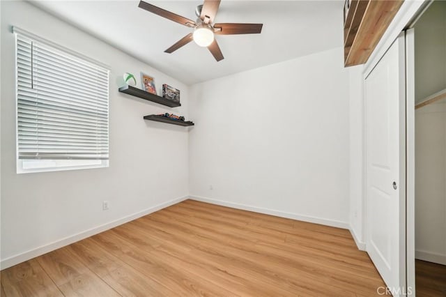 16233 Lozano St Unit 2, Fontana, CA 92336 - unfurnished bedroom featuring light wood finished floors, a closet, baseboards, and a ceiling fan