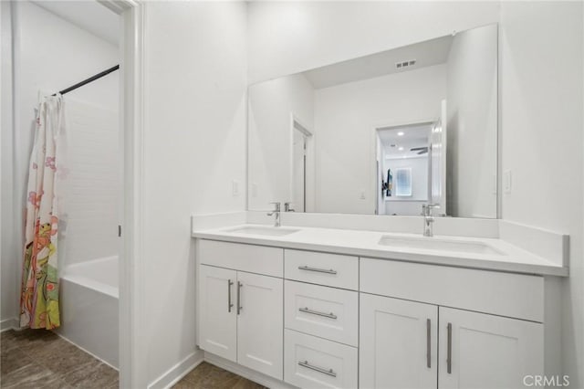 16233 Lozano St Unit 2, Fontana, CA 92336 - full bathroom with double vanity and shower / bath combination with curtain