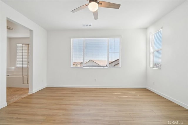 16233 Lozano St Unit 2, Fontana, CA 92336 - spare room featuring a ceiling fan, light wood-type flooring, and baseboards