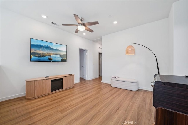 16233 Lozano St Unit 2, Fontana, CA 92336 - unfurnished living room featuring light wood-style flooring, ceiling fan, baseboards, and recessed lighting