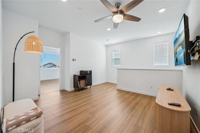 16233 Lozano St Unit 2, Fontana, CA 92336 - living room with a ceiling fan, light wood-style floors, recessed lighting, and baseboards