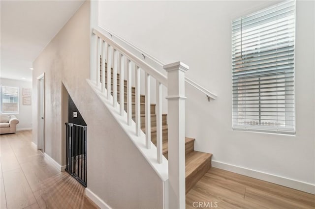 16233 Lozano St Unit 2, Fontana, CA 92336 - staircase with wood finished floors and baseboards