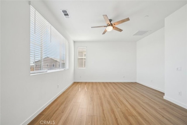 16233 Lozano St Unit 2, Fontana, CA 92336 - unfurnished room with a ceiling fan, light wood-style flooring, and baseboards