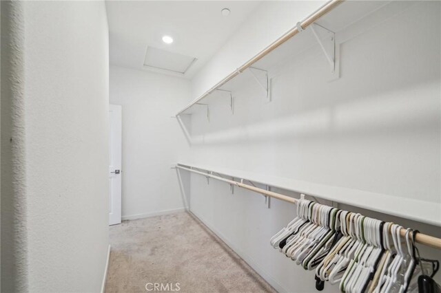 16233 Lozano St Unit 2, Fontana, CA 92336 - spacious closet with light colored carpet and attic access