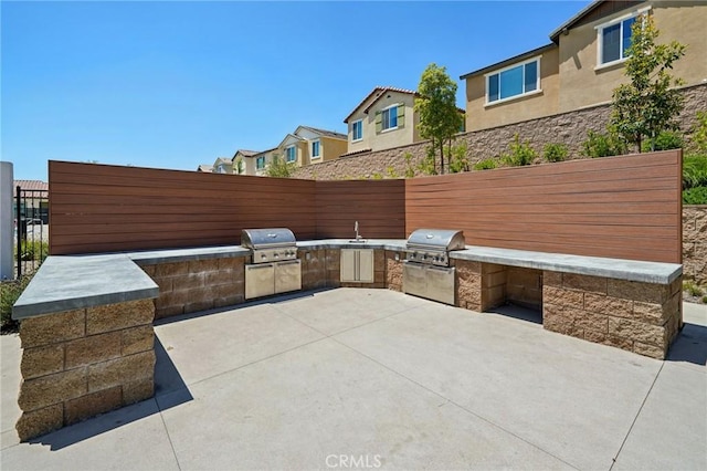 16233 Lozano St Unit 2, Fontana, CA 92336 - view of patio featuring a residential view and a sink