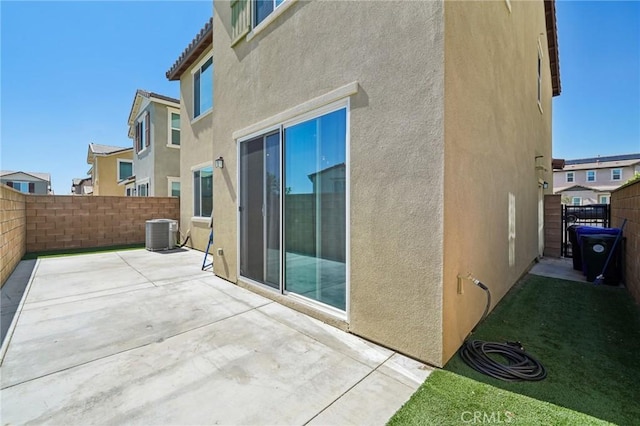 16233 Lozano St Unit 2, Fontana, CA 92336 - fenced backyard featuring central AC, a patio area, and a residential view