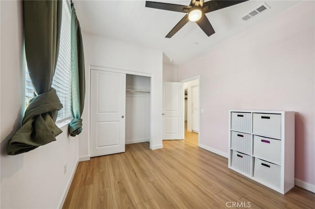 16233 Lozano St Unit 2, Fontana, CA 92336 - unfurnished bedroom with light wood finished floors, baseboards, a closet, and a ceiling fan