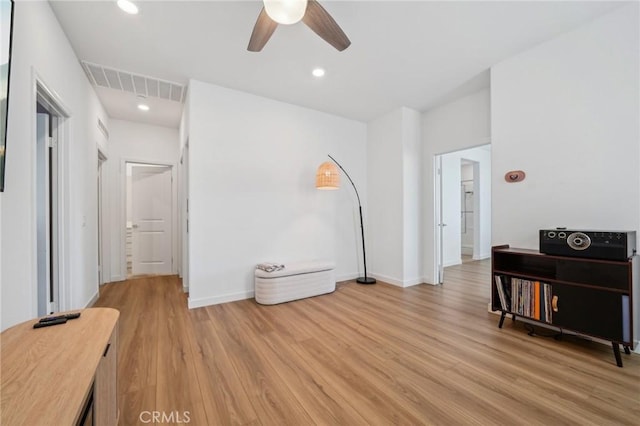 16233 Lozano St Unit 2, Fontana, CA 92336 - living area featuring ceiling fan, light wood-type flooring, and baseboards