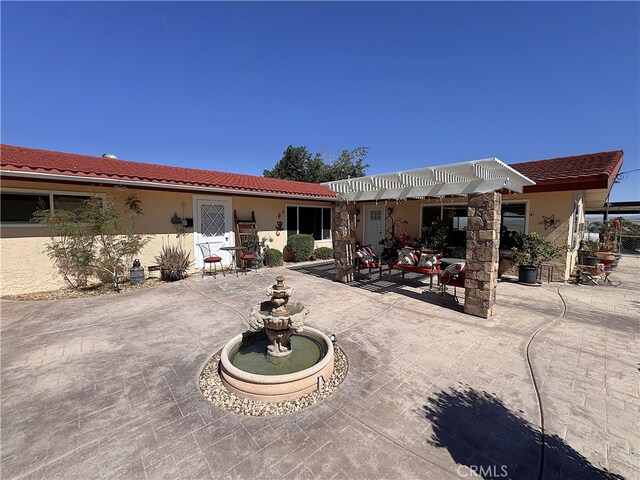 27568 Linda Vista Rd, Barstow, CA 92311 - back of property featuring a patio, a tiled roof, and stucco siding