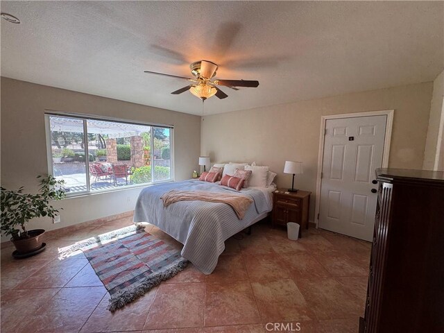 27568 Linda Vista Rd, Barstow, CA 92311 - bedroom with a textured ceiling, ceiling fan, and baseboards