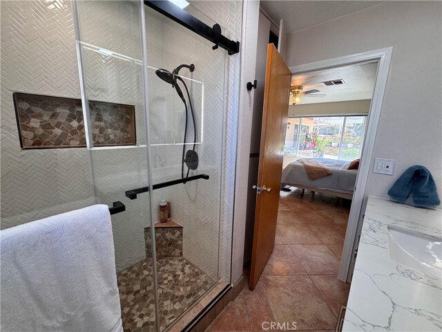 27568 Linda Vista Rd, Barstow, CA 92311 - bathroom featuring ensuite bathroom, a stall shower, a ceiling fan, and a sink