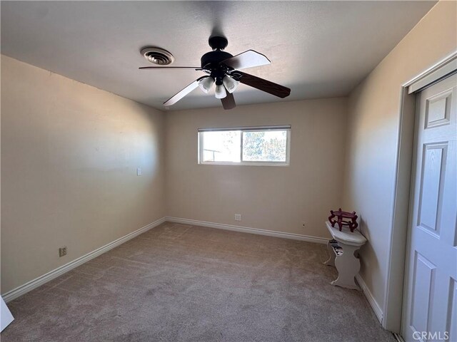 27568 Linda Vista Rd, Barstow, CA 92311 - unfurnished room with carpet, a ceiling fan, and baseboards