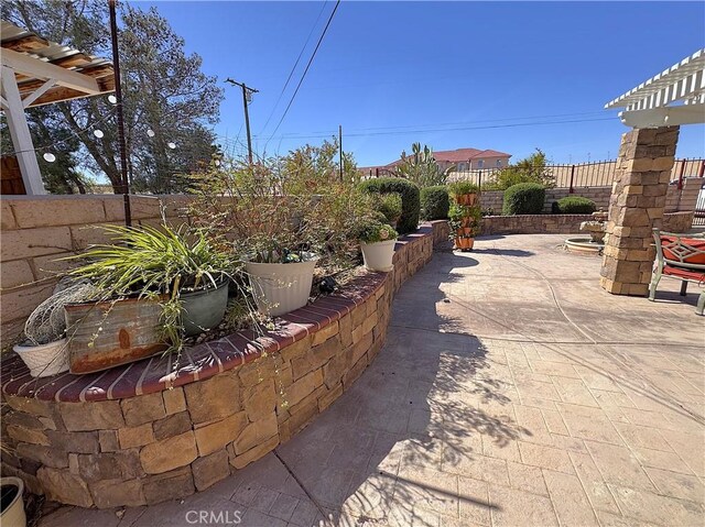 27568 Linda Vista Rd, Barstow, CA 92311 - fenced backyard featuring a patio area